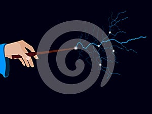 Magic wand. Hand holding a wand on a black background. Lightning spell.