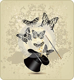 Magic wand and hat with butterflies on a vintage b
