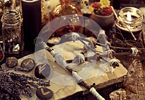 Magic wand, pentagram, lavender bunch, moth and runes, toned image