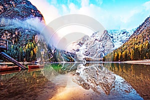 Magical autumn landscape with boats on the lake on Fanes-Sennes-Braies natural park in the Dolomites in South Tyrol, Alps, Italy