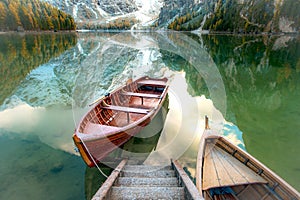 Magical beautiful fairy autumn landscape with boats on the lake