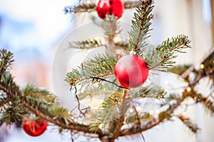 Magical Christmas market: Decoration with Christmas bauble on a fir branch