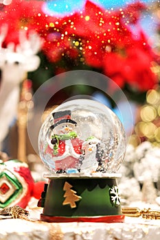 Magical Christmas snow globe with snowman and penguin