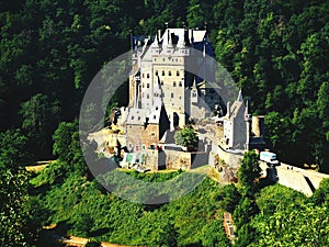 Magical: Eltz Castle With its unique location in the heart of the wild natural scenery of the Elzbach valley and its fascinating. photo