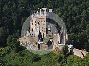 Magical: Eltz Castle With its unique location in the heart of the wild natural scenery of the Elzbach valley-Germany photo