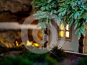 - a magical fairy-tale house in the forest. there is a light in the window