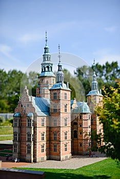 magical fascinating landscape with famous Rosenborg Castle near pond in palace garden in Copenhagen, Denmark. Exotic amazing