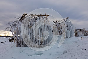 Magical ice house of elves in winter field
