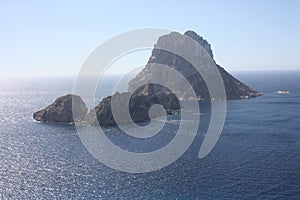 The magical island of Es Vedra with the small islet of Es Vedranell next to it in front of the coast of Cala d`Hort in the touris