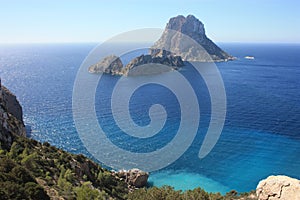 The magical island of Es Vedra with the small islet of Es Vedranell next to it in front of the coast of Cala d`Hort in the touris