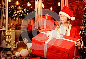 magical joy. kid with present box. winter shopping sale. cheerful little girl at christmas tree. decorate home with joy