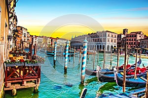 magical landscape with gondolas and boats on the Grand Canal in Venice, Italy at dawn. popular tourist attraction. Wonderful