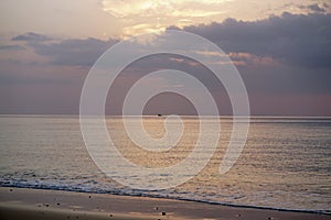 Magical ocean. Sunrise over the Atlantic. Morning. Waves of the surf. Beach