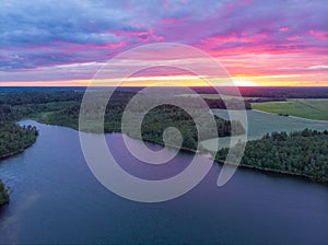 Magical purple sunset over lake in Belarus