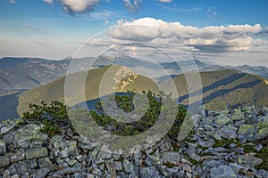 Magical summer sunset in the Carpathian mountains with over the rocky outcrops of the Gorgan region. Picturesque sunset in the mou