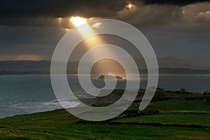 Magical sunbeam over the island lighthouse