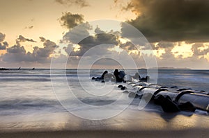 Magical sunrise scenery on the beach with stunning color background ,dramatic clouds.