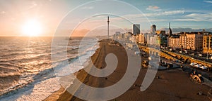 Magical sunset aerial view of British Airways i360 viewing tower pod with tourists in Brighton