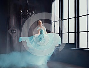 The magical transformation of Cinderella into a beautiful princess in a luxurious dress. Young women are blonde