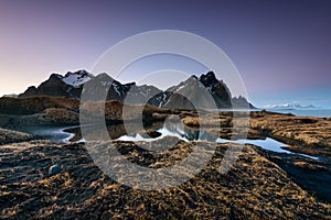 Magical Vestrahorn Mountains and Beach in Iceland at sunrise.