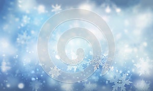 Magical winter background with snow,snowflakes and soft bokeh lights on blue sky,cold backdrop for Christmas. Snowy