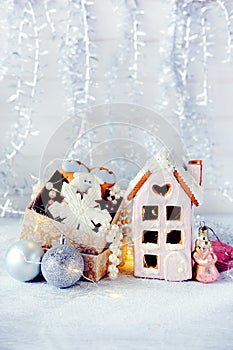 Magical winter christmas picture. Gingerbread house with snow.