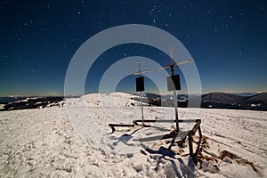 Magical winter landscape with snow covered tree. Vibrant night sky with stars and nebula and galaxy. Deep sky astrophoto