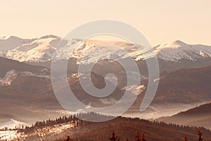 The magical winter landscape. Sunset in the mountains.