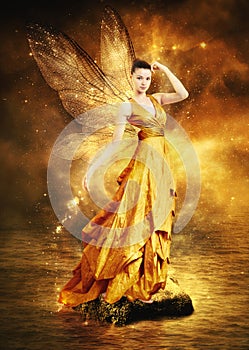 Magical young woman as golden fairy