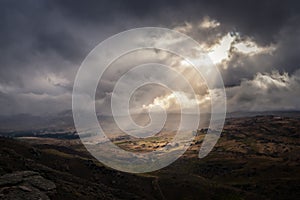 Magically ray of light shining down on to landscape