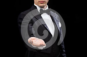 Magician holding something on palm of his hand