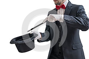 Magician or illusionist is showing magic trick. Isolated on white background