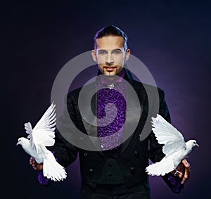 Magician man in stage costume