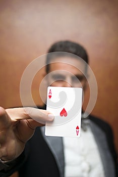 Magician performing with card