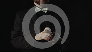 Magician Performing Card Trick. Throwing and Catching Cards in the Air. Close up