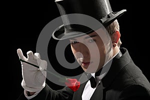 Magician performing red rose