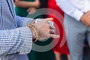 Magician showing card tricks focus in front of guests on party event wedding celebration, juggler performing show