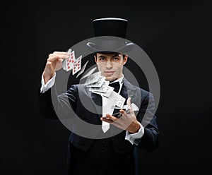 Magician showing trick with playing cards