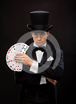 Magician showing trick with playing cards