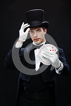 Magician showing trick with playing cards