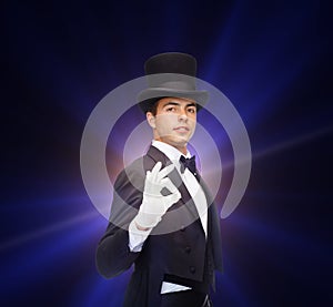 Magician in top hat showing trick