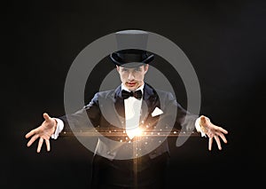 Magician in top hat showing trick