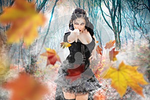 Magician witch power girl. Superpowers dark sorceress woman. Fall foliage forest.