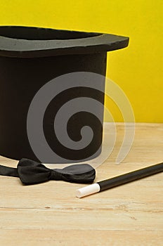 A magicians hat , wand and bow tie photo
