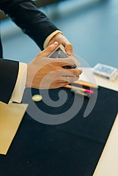 magicians man playing cards in focus