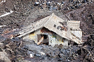 Magma, house engulfed by lava. Natural disaster