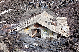 Magma, house engulfed by lava. Natural disaster photo