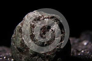 Magnesia fossil mineral stone. Geological crystalline fossil. Dark background close-up. photo