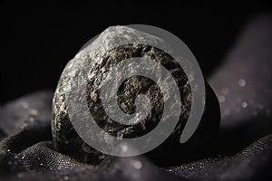 Magnesia fossil mineral stone. Geological crystalline fossil. Dark background close-up. photo