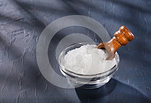 Magnesium chloride in wooden scoop - Text space